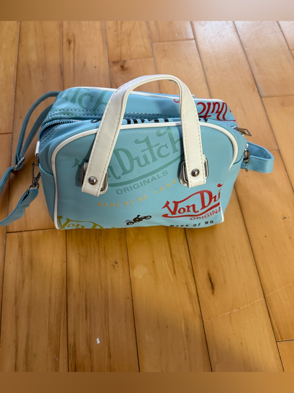 Von Dutch Light Blue Crossbody Bag with White Handles and Multicolor Logo